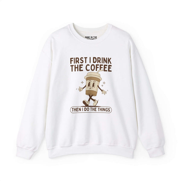 White sweatshirt with coffee cup graphic and text: 'First I Drink the Coffee Then I Do the Things'.