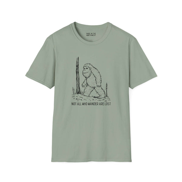Not All Who Wander Are Lost Bigfoot Softstyle T-Shirt featuring Sasquatch design on a green background.