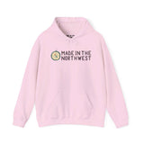 Pink Made in the Northwest hoodie with compass logo and text, showcasing Pacific Northwest pride and adventure spirit.