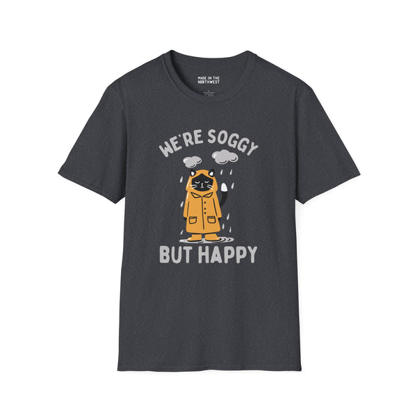 Funny 'We're Soggy But Happy' t-shirt featuring a drenched cat in a raincoat, perfect for rainy day enthusiasts.