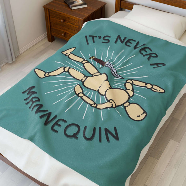 It's Never a Mannequin True Crime Lightweight Cozy Blanket featuring a playful mannequin design.