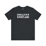 Home Is in Portland Tee – Rose City Pride Shirt featuring campfire, tree, and Bigfoot illustrations.
