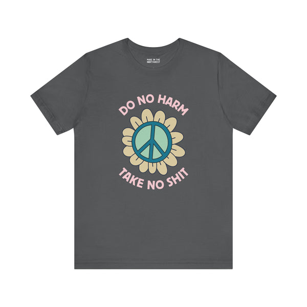 Do No Harm, Take No Sh!t premium soft tee with bold peace flower design, embodying kindness and strength.