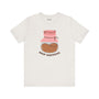 White coffee-themed soft tee featuring a playful 'Drip Happens' graphic and coffee bean illustration.