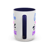 Side view of a Coffee Is My Love Language Mug with colorful design and navy handle.