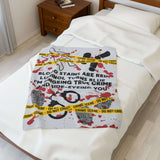 The Crime Scene Snuggle Lightweight Blanket for True Crime Lovers featuring crime scene tape and splattered evidence.