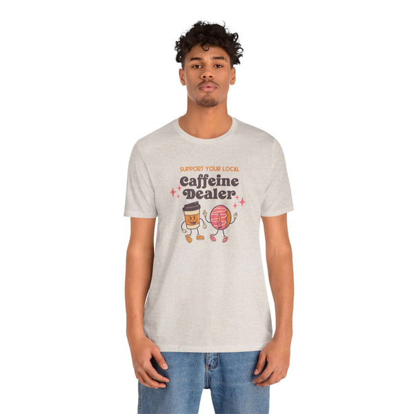 Man wearing 'Support Your Local Caffeine Dealer' coffee-themed soft tee, celebrating local coffee culture.