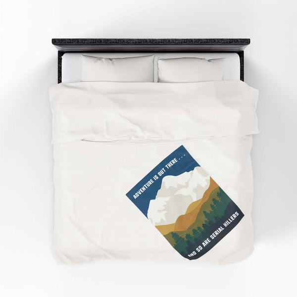 Adventure Is Out There and So Are Serial Killers Lightweight Cozy Blanket on a bed with nature design.