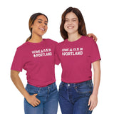 Two women wearing the Home Is in Portland tee, celebrating Rose City pride with a vibrant design.