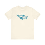 Locally Hated soft tee with bold cursive font in blue, perfect for standing out with style in the Pacific Northwest.