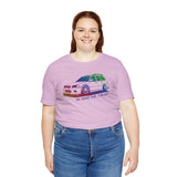 Woman wearing lavender In AWD We Trust tee featuring a slammed Subaru WRX wagon graphic.