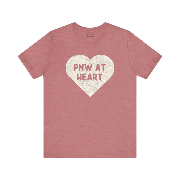 Maroon t-shirt with a heart-shaped map design and "PNW at Heart" text, celebrating Pacific Northwest pride.