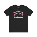 True Crime is My Love Language T Shirt featuring pink heart-shaped handcuffs on a black background.