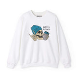 White sweatshirt with a skeleton graphic wearing a blue beanie, holding a coffee cup, and text 