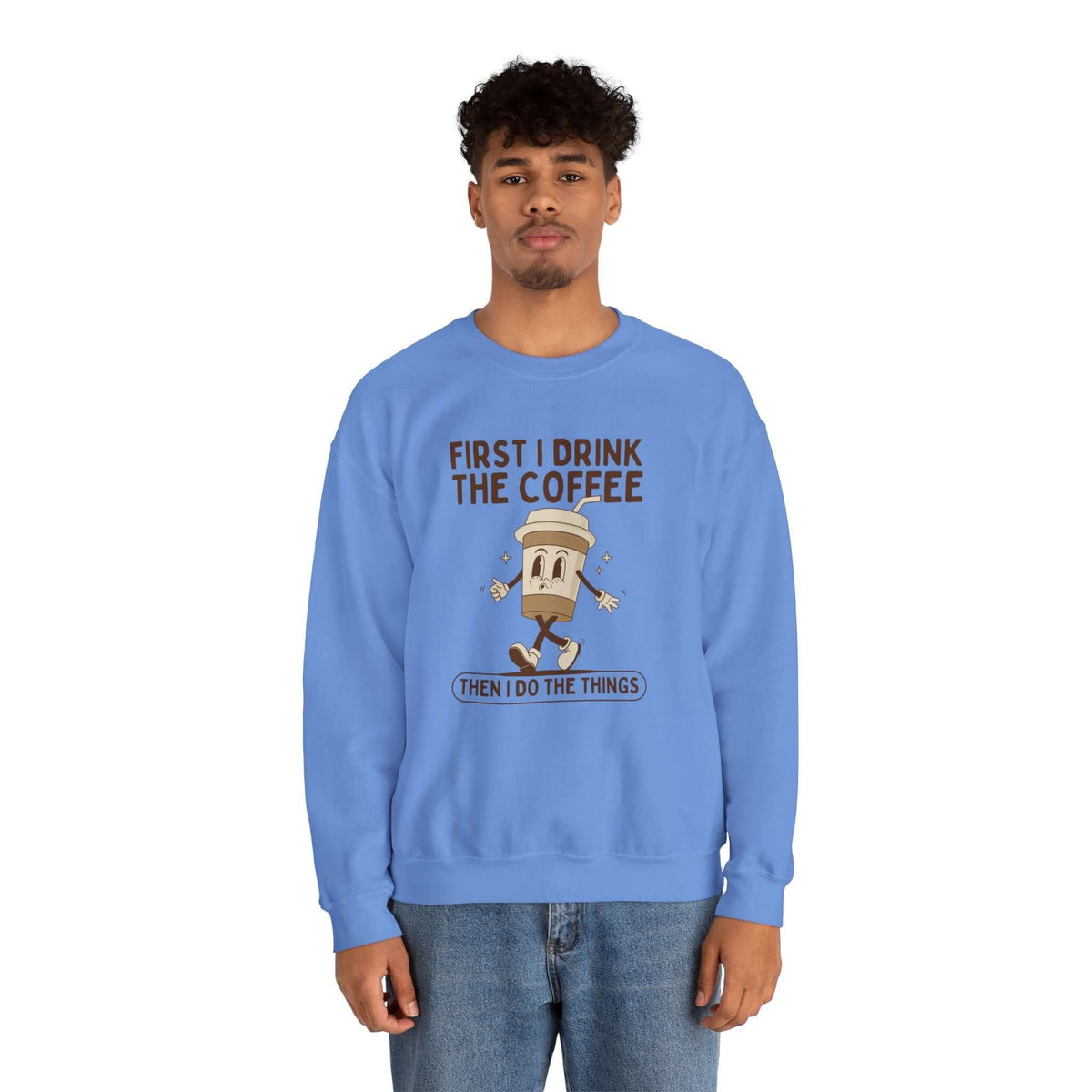 Blue sweatshirt with 'First I Drink the Coffee Then I Do the Things' graphic design.