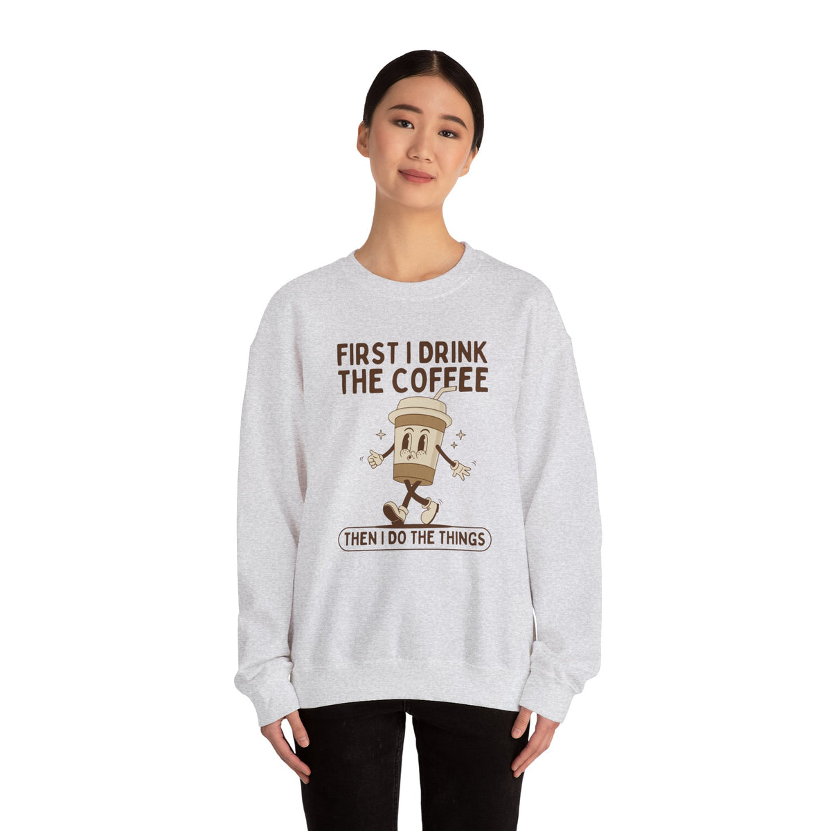 Cozy sweatshirt with 'First I Drink the Coffee Then I Do the Things' printed design, perfect for coffee lovers.