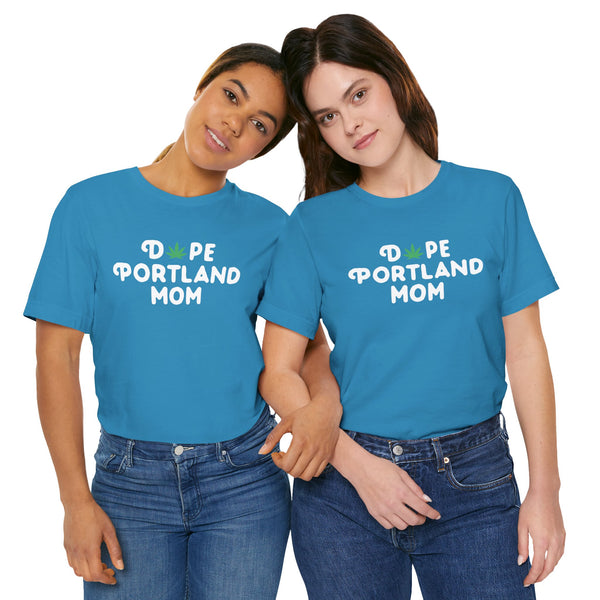 Two women wearing Dope Portland Mom tees with marijuana leaf design, showcasing vibrant PDX pride and laid-back style.