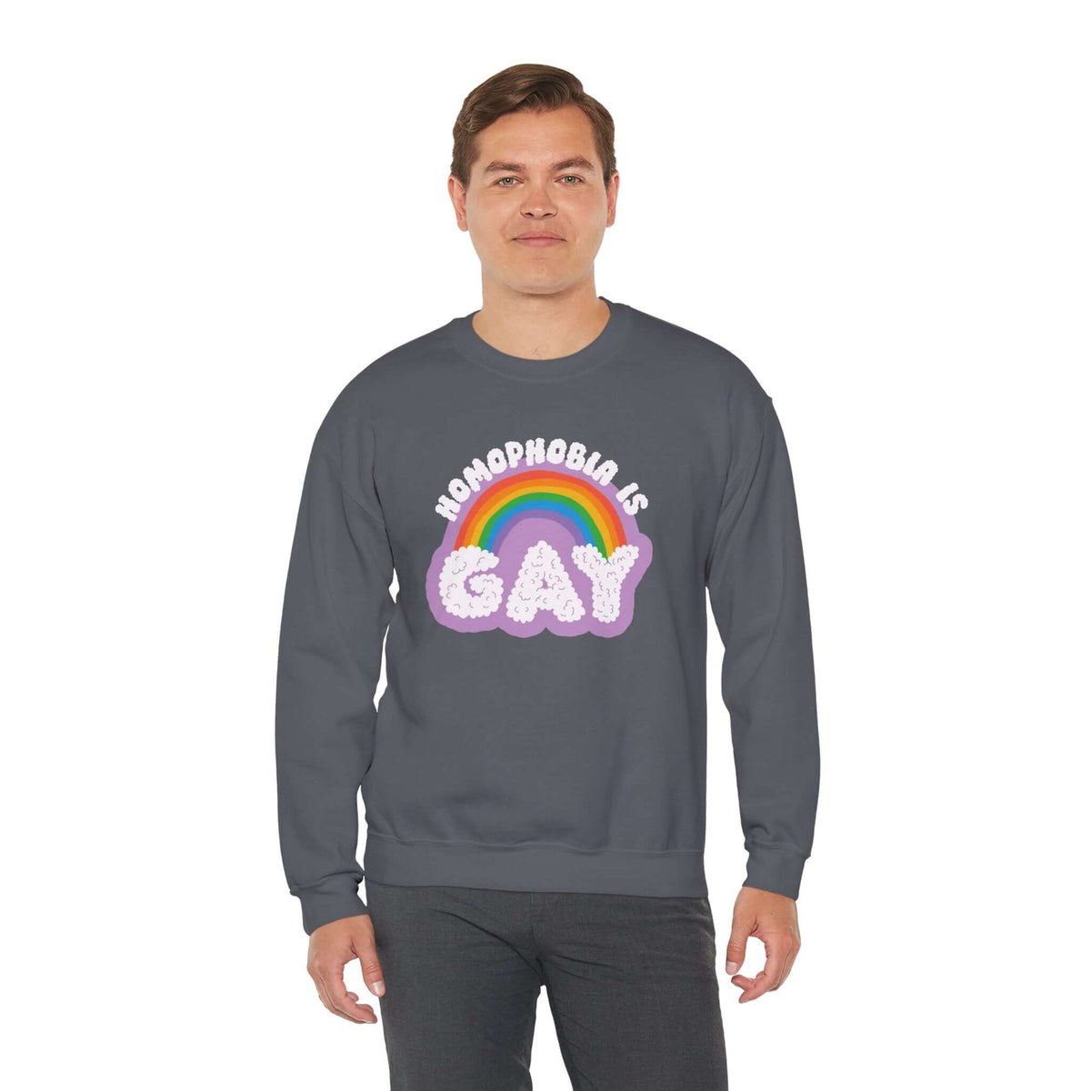 Model wearing a dark Homophobia Is Gay sweatshirt with rainbow design, promoting pride and style.