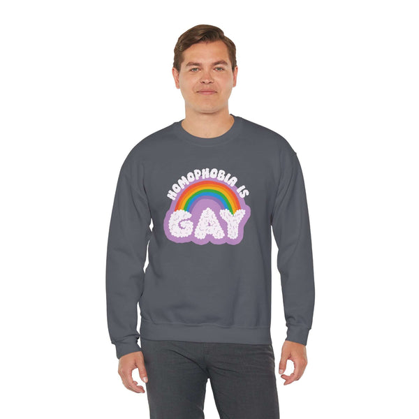 Model wearing a dark Homophobia Is Gay sweatshirt with rainbow design, promoting pride and style.