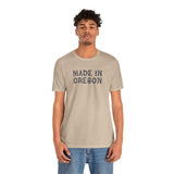 Premium soft tee with 'Made in Oregon' rustic log font, perfect for outdoor lovers and Oregon heritage enthusiasts.