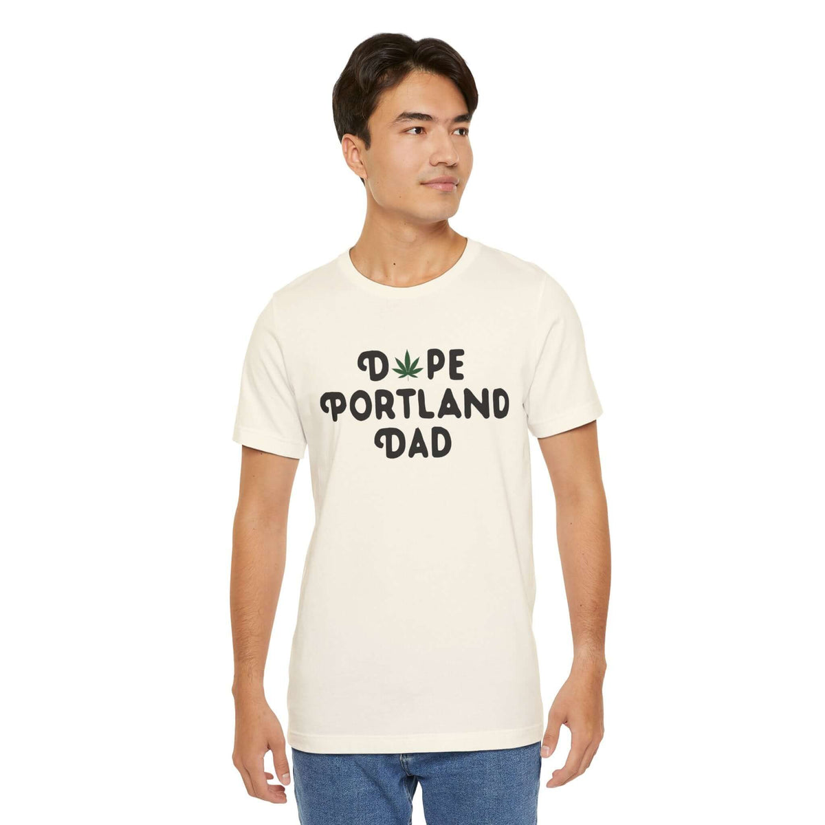 Man wearing 'Dope Portland Dad' tee with marijuana leaf design, showcasing relaxed and vibrant Portland spirit.