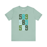 Five-Oh-Nine Pop Premium Soft Tee featuring bold stacked '509' design in vibrant colors on a light green background.