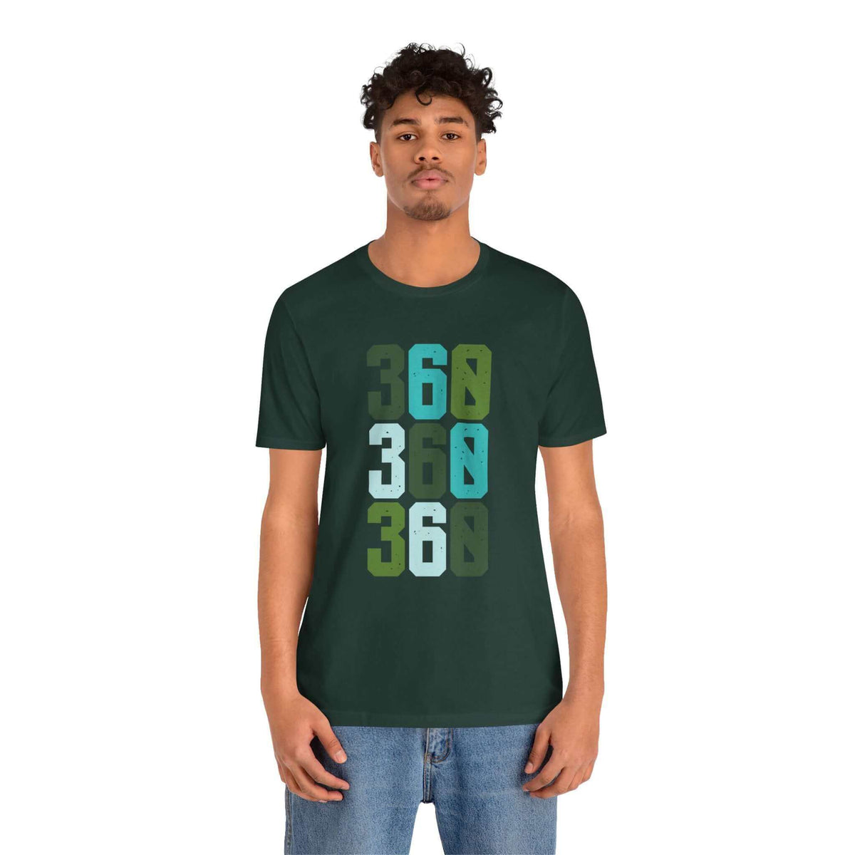 Man wearing green 'Three-Six-Oh Pop Soft Tee' with 360 area code design in bold colors, celebrating Pacific Northwest pride.