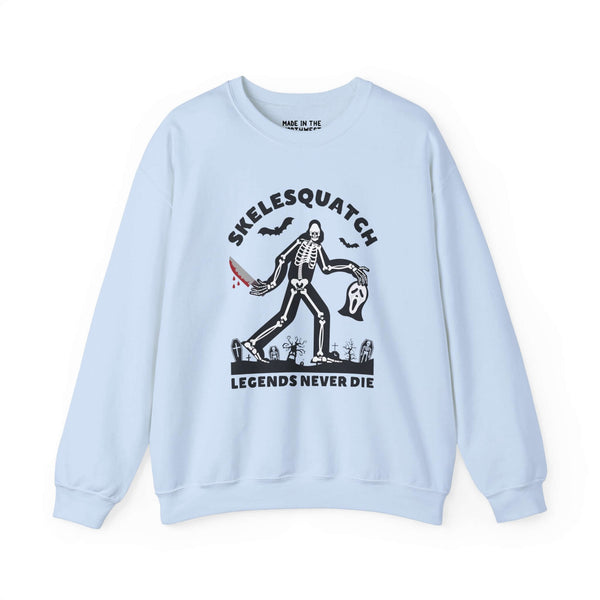 Skelesquatch Legends Never Die Halloween sweatshirt with skeleton sasquatch, bloody knife, scream mask, and graveyard scene.