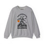 Skelesquatch Halloween sweatshirt featuring a skeleton Sasquatch with a pumpkin in a graveyard design.