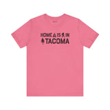 Home is in Tacoma tee in pink featuring campfire and tree graphics, celebrating Grit City pride.