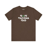 Dope Tacoma Dad soft tee in brown with playful marijuana leaf in 'O', celebrating Tacoma's local vibe.