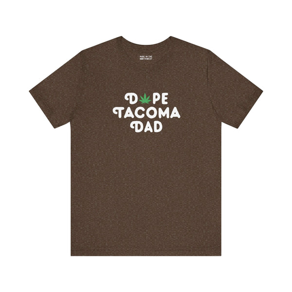Dope Tacoma Dad soft tee in brown with playful marijuana leaf in 'O', celebrating Tacoma's local vibe.