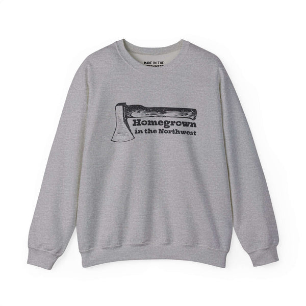 Grey sweatshirt featuring "Homegrown in the Northwest" design with an axe, celebrating Pacific Northwest spirit and resilience.