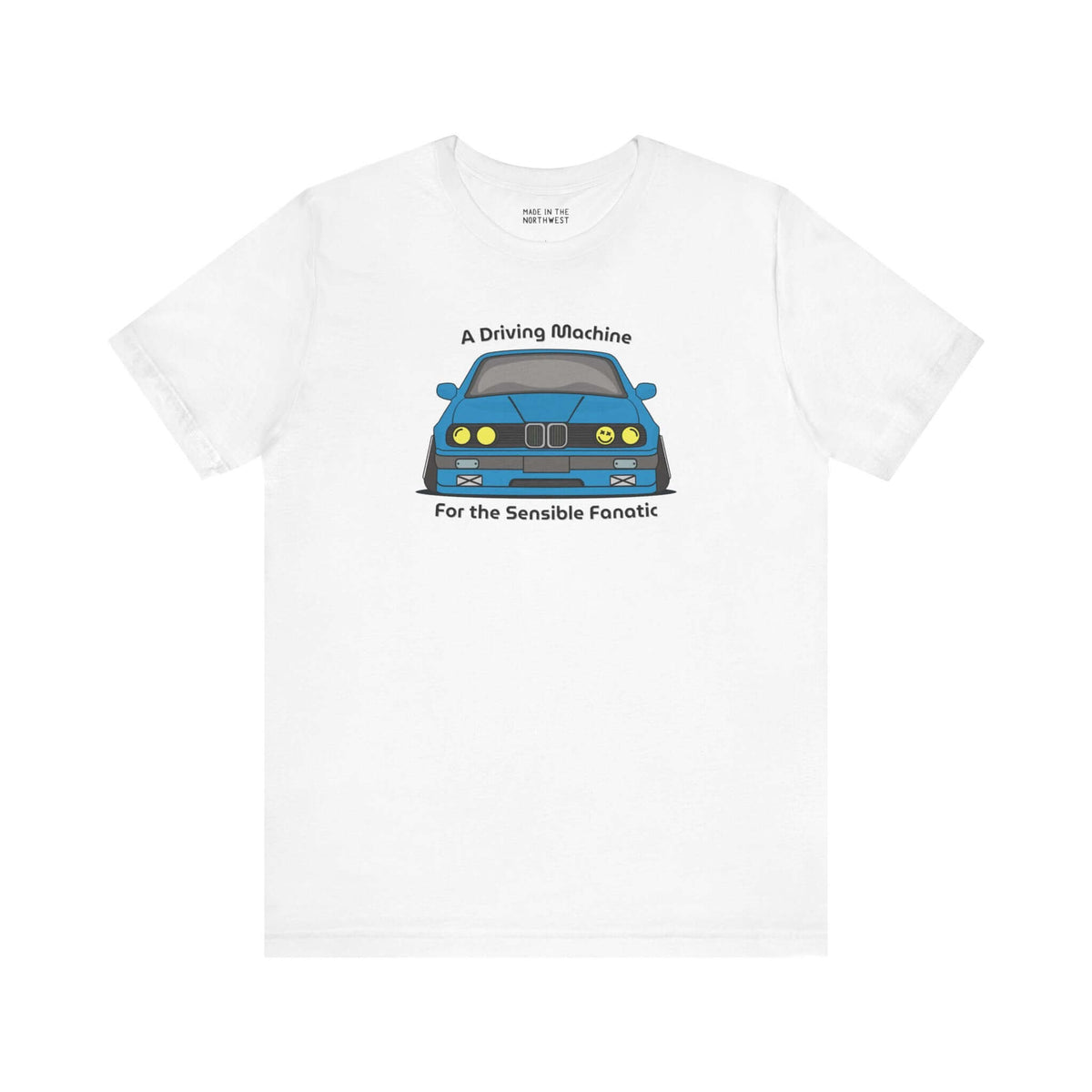 White soft tee featuring BMW E30 design with text 'A Driving Machine for the Sensible Fanatic'.