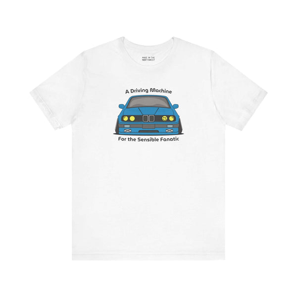White soft tee featuring BMW E30 design with text 'A Driving Machine for the Sensible Fanatic'.