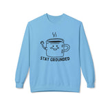 Stay Grounded sweatshirt with minimalist mug design on a blue crewneck, promoting calm and comfort.