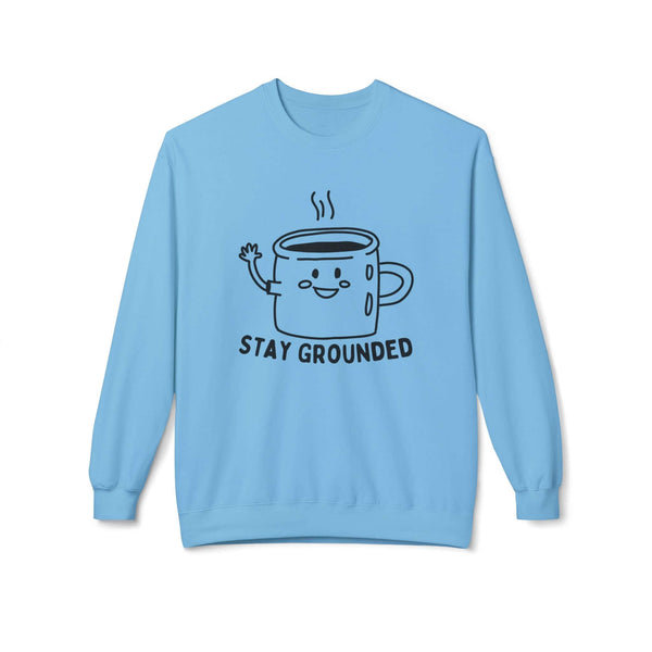 Stay Grounded sweatshirt with minimalist mug design on a blue crewneck, promoting calm and comfort.