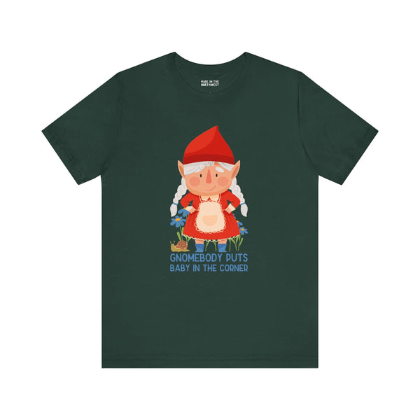 Green tee with a cute female gnome and the text "Gnomebody Puts Baby in the Corner" offering a playful twist on a classic movie line.