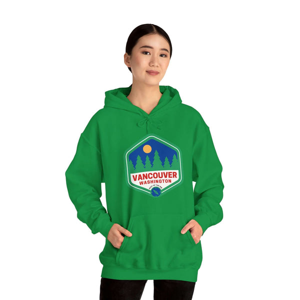 Woman wearing green Vancouver hoodie with 90s-inspired badge featuring trees, celebrating Northwest charm and community spirit.