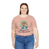 Woman wearing a pink Brewed in the Northwest coffee tee, celebrating PNW pride and coffee culture.