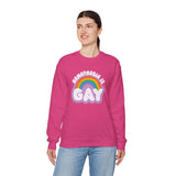 Woman wearing a pink sweatshirt with 'Homophobia is Gay' and a rainbow design, showcasing pride and style.