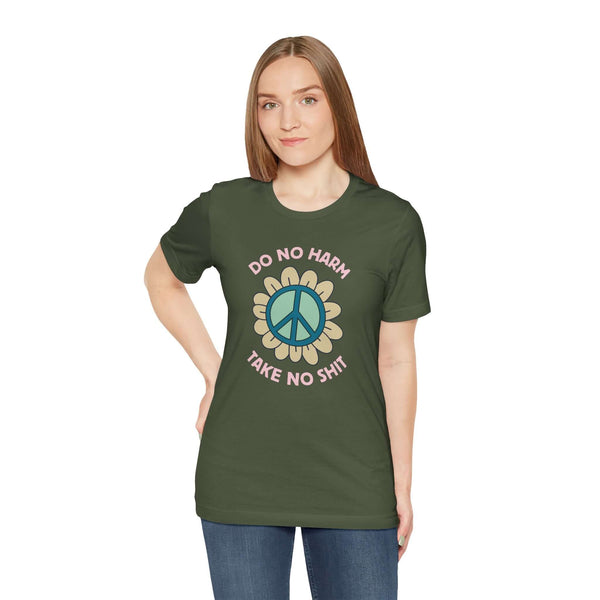 Woman wearing 'Do No Harm, Take No Sh!t' premium soft tee with peace flower design.