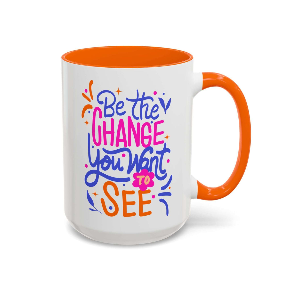 Be the Change You Want to See Mug with vibrant hand-lettered design and colorful orange handle.