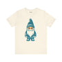 Teal gnome wearing daisy sunglasses on a cream soft tee, perfect for whimsical PNW-inspired style.