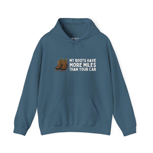 Unisex hoodie with the text 'My Boots Have More Miles Than Your Car' and hiking boots design, perfect for outdoor enthusiasts.