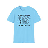 Stay at Home Detective T Shirt featuring playful crime scene graphics and text on a light blue background.