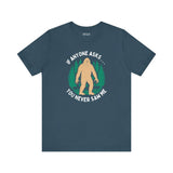 You Never Saw Me Tee featuring a Bigfoot silhouette and text on a dark blue shirt, perfect for humor lovers.