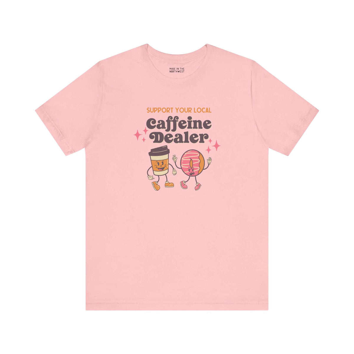 Support Your Local Caffeine Dealer coffee soft tee in pink featuring fun coffee cup and donut graphics.