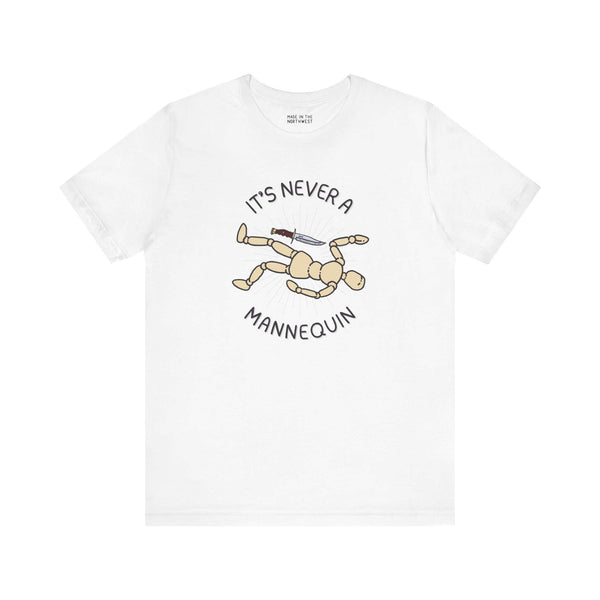 It's Never a Mannequin true crime premium soft tee featuring a playful design with a mannequin and knife.