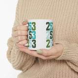 Two-Five-Three Pop Tacoma Ceramic Mug with colorful area code design in hands, perfect for coffee lovers.